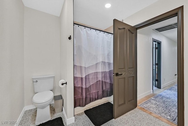 2740 Family Ct, Las Vegas, NV 89117 - bathroom with toilet and shower / bath combo with shower curtain