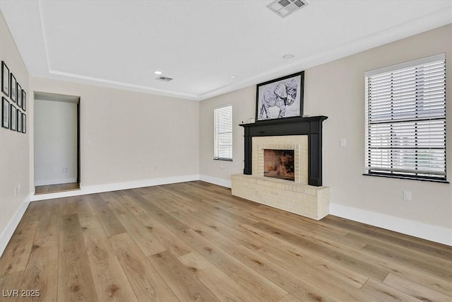 2740 Family Ct, Las Vegas, NV 89117 - unfurnished living room featuring hardwood / wood-style floors, a fireplace, and recessed lighting