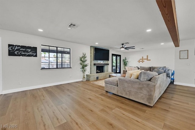 2740 Family Ct, Las Vegas, NV 89117 - living room featuring light wood finished floors, recessed lighting, ceiling fan, and a large fireplace