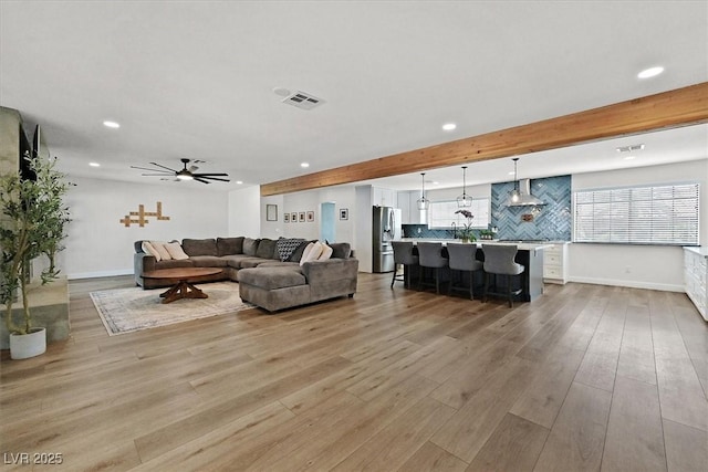 2740 Family Ct, Las Vegas, NV 89117 - living room featuring recessed lighting, wood finished floors, beamed ceiling, and ceiling fan