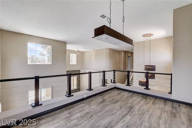 8113 Gothic Ave, Las Vegas, NV 89117 - unfurnished room featuring wood finished floors and a chandelier