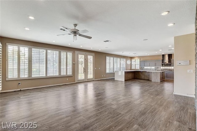 8113 Gothic Ave, Las Vegas, NV 89117 - unfurnished living room with dark wood-style flooring, recessed lighting, and a ceiling fan