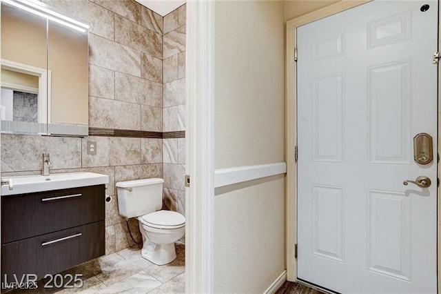 8113 Gothic Ave, Las Vegas, NV 89117 - bathroom featuring vanity and tile walls