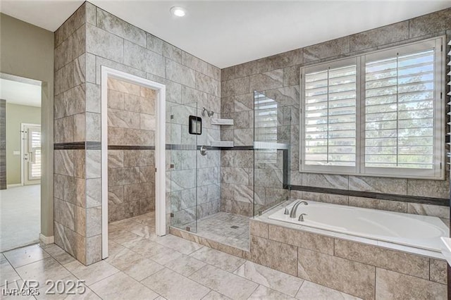8113 Gothic Ave, Las Vegas, NV 89117 - full bath featuring a garden tub, a stall shower, tile patterned flooring, and recessed lighting