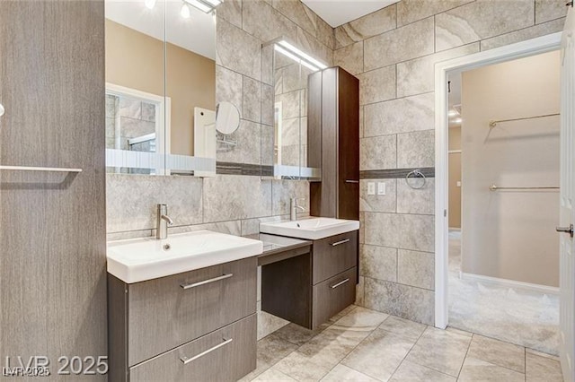 8113 Gothic Ave, Las Vegas, NV 89117 - bathroom with tile walls, two vanities, and tile patterned floors