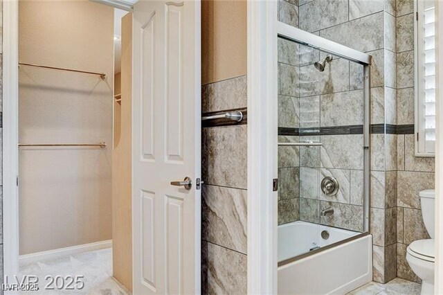 8113 Gothic Ave, Las Vegas, NV 89117 - full bathroom with bath / shower combo with glass door, tile walls, and a closet