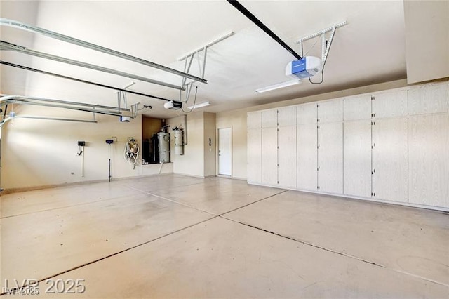 8113 Gothic Ave, Las Vegas, NV 89117 - garage with a garage door opener and secured water heater