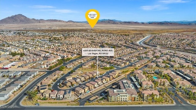 6301 Beavertail Pond Ave, Las Vegas, NV 89122 - aerial view of property and surrounding area with a mountain backdrop and nearby suburban area