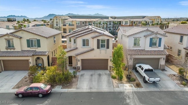 6301 Beavertail Pond Ave, Las Vegas, NV 89122 - view of front of home featuring a residential view, a garage, concrete driveway, and a mountain view