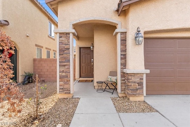 6301 Beavertail Pond Ave, Las Vegas, NV 89122 - entrance to property featuring stucco siding, stone siding, and an attached garage
