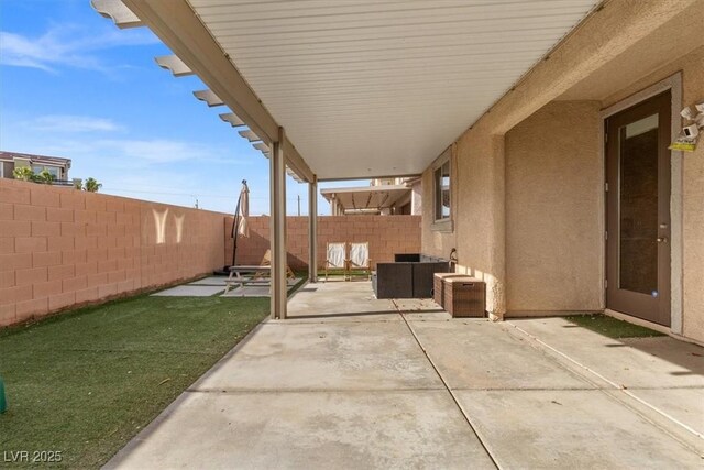 6301 Beavertail Pond Ave, Las Vegas, NV 89122 - fenced backyard with a patio area