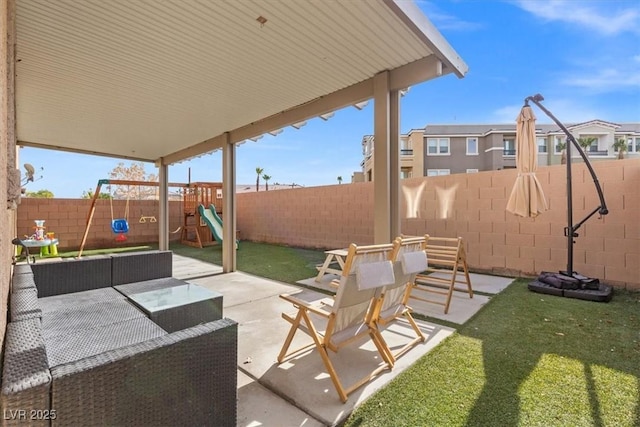 6301 Beavertail Pond Ave, Las Vegas, NV 89122 - fenced backyard with a playground, a patio area, and an outdoor hangout area