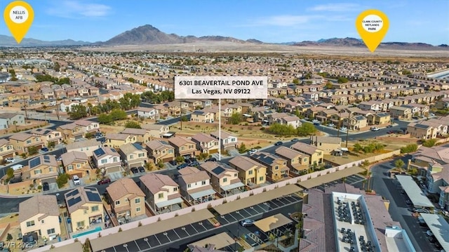 6301 Beavertail Pond Ave, Las Vegas, NV 89122 - aerial view of residential area with a mountain backdrop