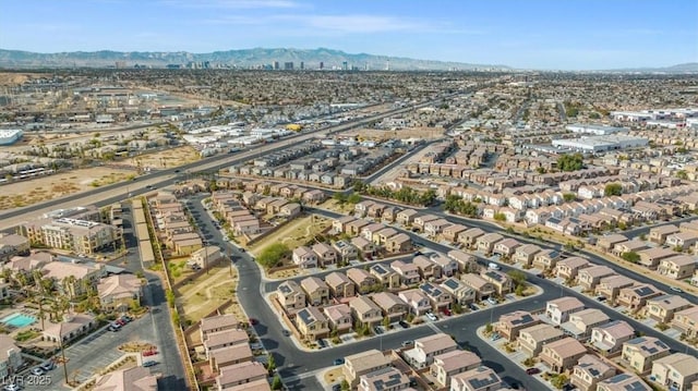 6301 Beavertail Pond Ave, Las Vegas, NV 89122 - aerial overview of property's location with mountains and nearby suburban area