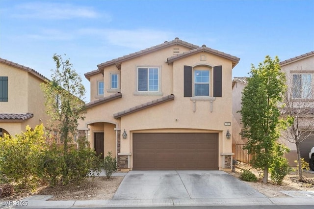 6301 Beavertail Pond Ave, Las Vegas, NV 89122 - mediterranean / spanish house with an attached garage, a tile roof, concrete driveway, and stucco siding