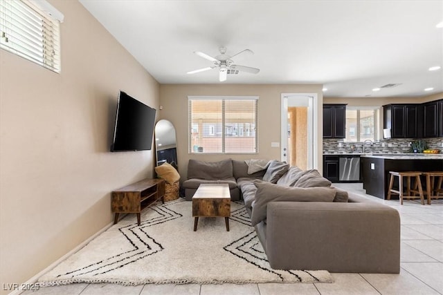 6301 Beavertail Pond Ave, Las Vegas, NV 89122 - living room with a ceiling fan and light tile patterned floors