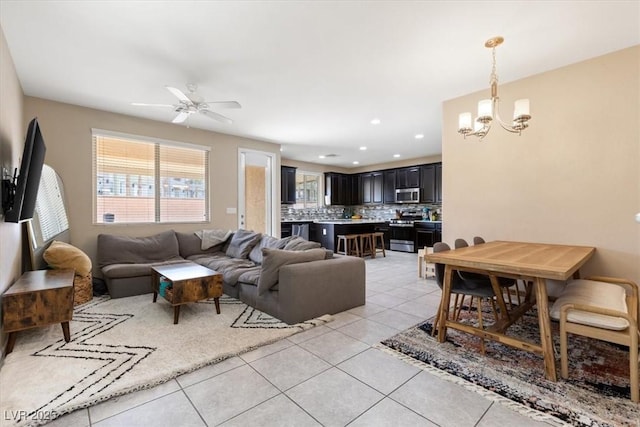 6301 Beavertail Pond Ave, Las Vegas, NV 89122 - living area with a chandelier, light tile patterned flooring, ceiling fan, and recessed lighting