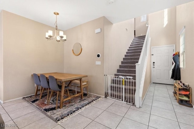 6301 Beavertail Pond Ave, Las Vegas, NV 89122 - dining space with a chandelier, light tile patterned floors, and stairway