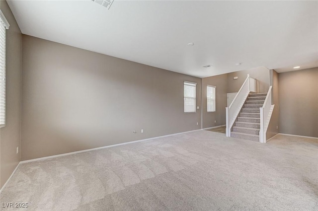 7534 Earnshaw Ave, Las Vegas, NV 89179 - unfurnished living room with carpet flooring and stairs