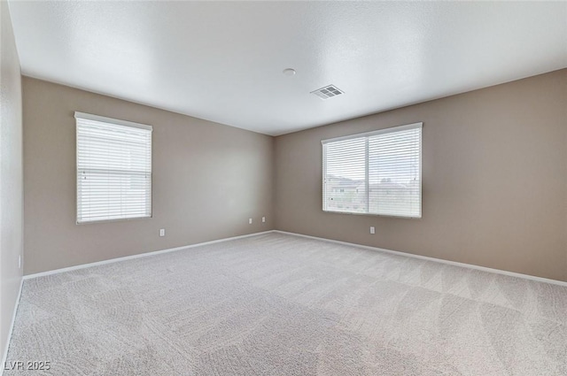 7534 Earnshaw Ave, Las Vegas, NV 89179 - spare room featuring plenty of natural light and carpet