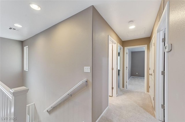 7534 Earnshaw Ave, Las Vegas, NV 89179 - hallway with an upstairs landing, light colored carpet, and recessed lighting