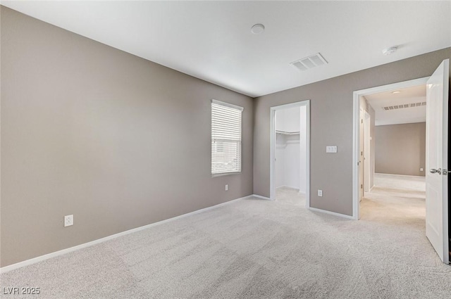 7534 Earnshaw Ave, Las Vegas, NV 89179 - unfurnished bedroom featuring light carpet and a spacious closet