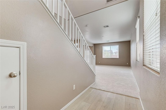 7534 Earnshaw Ave, Las Vegas, NV 89179 - staircase featuring wood finished floors and a textured wall