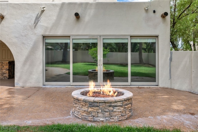 7045 Edna Ave, Las Vegas, NV 89117 - view of patio featuring a fire pit