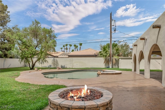 7045 Edna Ave, Las Vegas, NV 89117 - view of pool with a fenced backyard, an outdoor fire pit, a patio, and a pool with connected hot tub