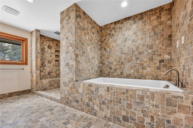 7045 Edna Ave, Las Vegas, NV 89117 - bathroom with a bath, tiled shower, tile walls, recessed lighting, and stone finish flooring