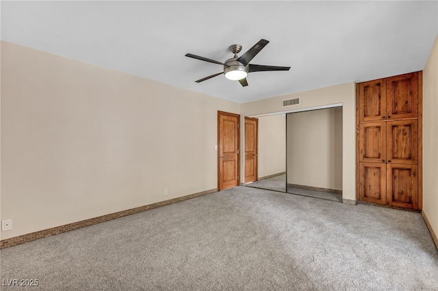 7045 Edna Ave, Las Vegas, NV 89117 - unfurnished bedroom featuring carpet, a closet, and ceiling fan
