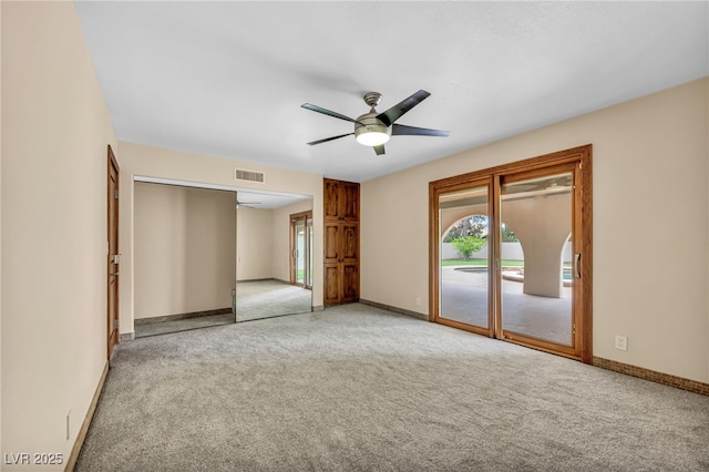 7045 Edna Ave, Las Vegas, NV 89117 - unfurnished bedroom with access to exterior, carpet, and ceiling fan
