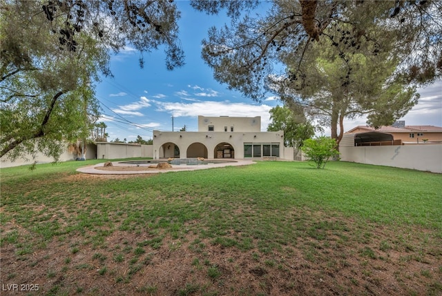 7045 Edna Ave, Las Vegas, NV 89117 - back of property with stucco siding and a lawn