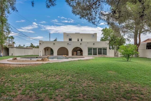 7045 Edna Ave, Las Vegas, NV 89117 - rear view of house with stucco siding and a lawn
