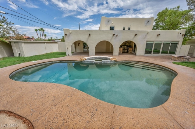 7045 Edna Ave, Las Vegas, NV 89117 - view of pool featuring a patio area and a pool with connected hot tub