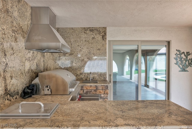 7045 Edna Ave, Las Vegas, NV 89117 - kitchen with range hood and a textured ceiling