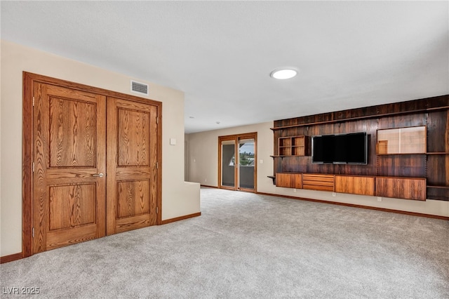 7045 Edna Ave, Las Vegas, NV 89117 - unfurnished living room with carpet floors and baseboards