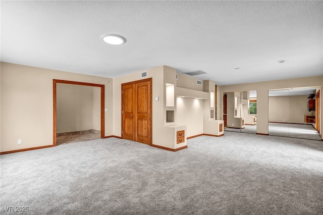 7045 Edna Ave, Las Vegas, NV 89117 - unfurnished living room with carpet floors and a textured ceiling