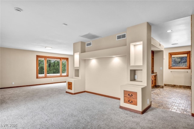 7045 Edna Ave, Las Vegas, NV 89117 - unfurnished living room featuring baseboards and carpet