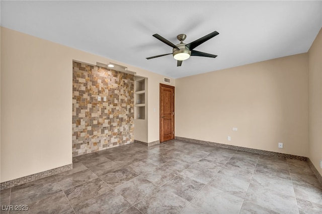 7045 Edna Ave, Las Vegas, NV 89117 - spare room featuring built in features and a ceiling fan