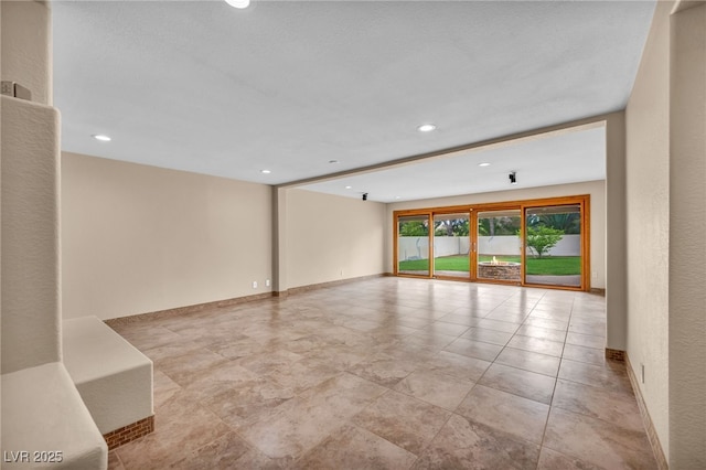 7045 Edna Ave, Las Vegas, NV 89117 - spare room featuring recessed lighting and baseboards