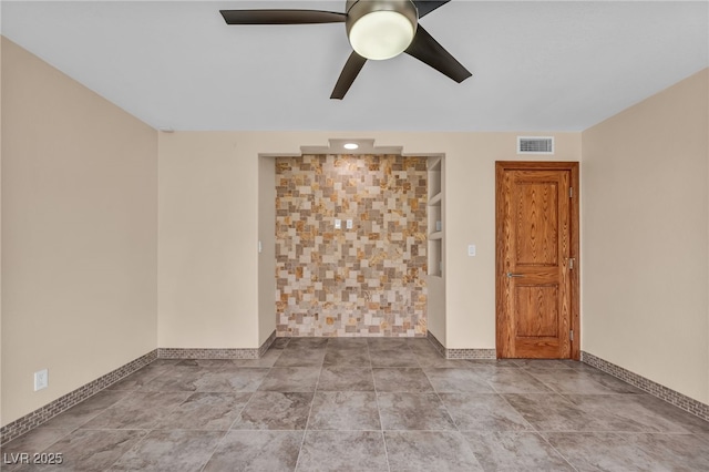 7045 Edna Ave, Las Vegas, NV 89117 - spare room with a ceiling fan and baseboards