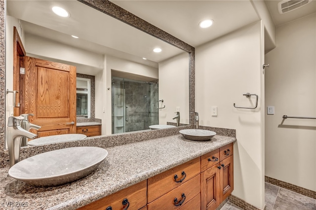 7045 Edna Ave, Las Vegas, NV 89117 - full bath with a stall shower, double vanity, and recessed lighting