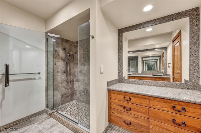 7045 Edna Ave, Las Vegas, NV 89117 - full bath featuring a shower stall, vanity, and recessed lighting