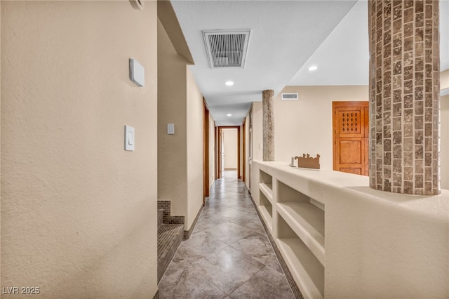 7045 Edna Ave, Las Vegas, NV 89117 - corridor with recessed lighting and a textured wall