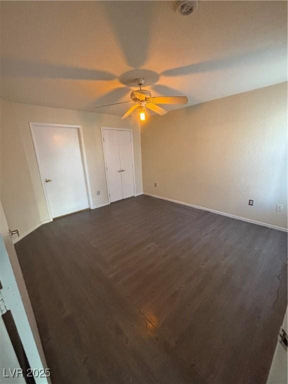 8101 W Flamingo Rd Unit 1109, Las Vegas, NV 89147 - unfurnished bedroom featuring dark wood finished floors and a ceiling fan