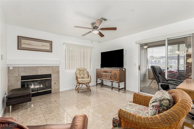 2725 S Nellis Blvd Unit 1037, Las Vegas, NV 89121 - tiled living room featuring ceiling fan and a fireplace