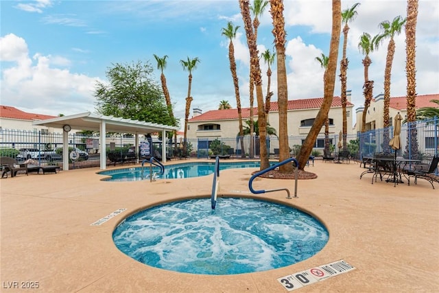 2725 S Nellis Blvd Unit 1037, Las Vegas, NV 89121 - community pool featuring a hot tub and a patio area
