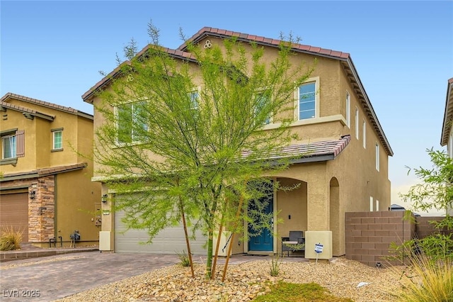 2821 Gaffer Film St, Las Vegas, NV 89156 - traditional home featuring stucco siding, driveway, and an attached garage