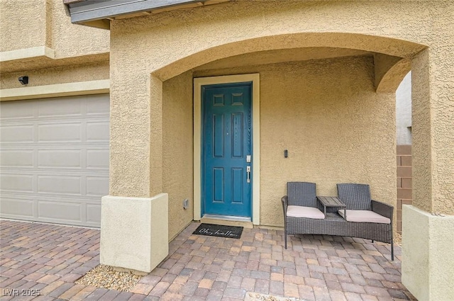 2821 Gaffer Film St, Las Vegas, NV 89156 - entrance to property with stucco siding and a garage